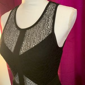 Size M Material Girl brand. Black w half lace w zipper. At the knee length.